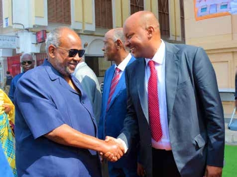 2Dahabshiil Group CEO Abdirashid Duale and President Ismail Omar Guelleh shake hands at the official opening of the East African Bank tower.